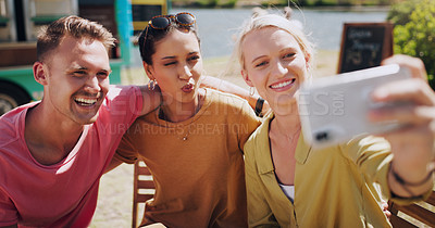 Buy stock photo Funny face, selfie and social media with friends outdoor together for profile picture update. App, mobile or technology with happy young man and woman group taking photograph for bonding or memory