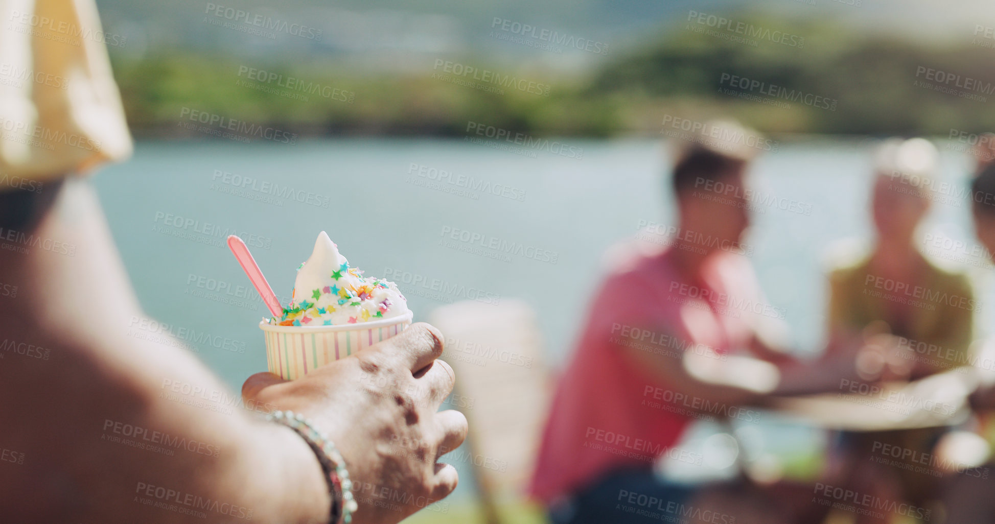 Buy stock photo Person, ice cream and cup outside for eat with plastic spoon at lake for fresh air in summer. Dessert, cold and sweet at park in Germany with vacation or weekend in sunshine with tasty snack.