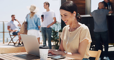 Buy stock photo Earphones, laptop and woman at outdoor cafe for remote work, networking or professional research. Headphones, computer and creative freelancer at coffee shop with music, streaming and online project