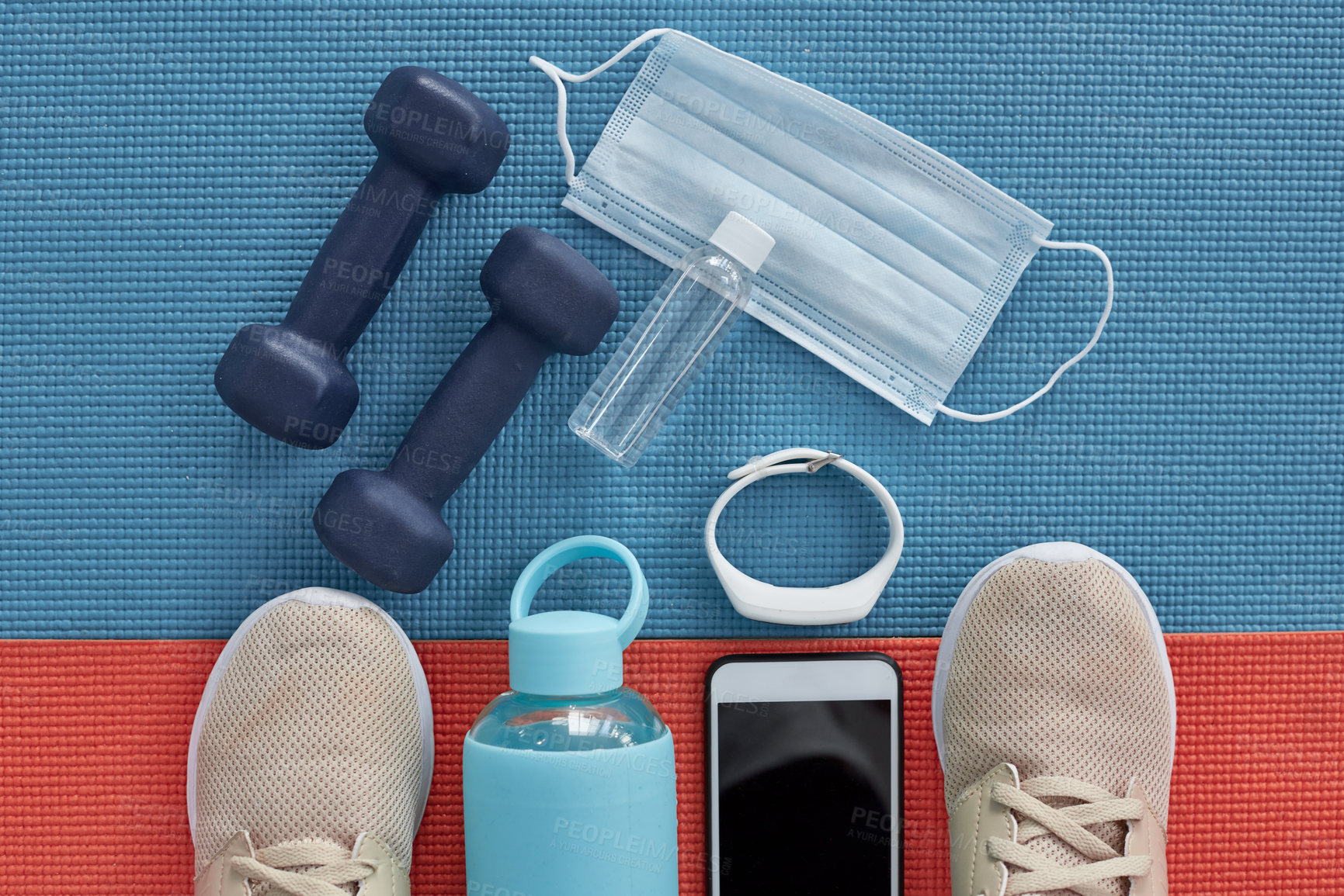 Buy stock photo Workout, equipment and face mask on yoga mat with tech for fitness tracker and gym progress. Above, floor and wellbeing for illness prevention at health and wellness club for sport with weights