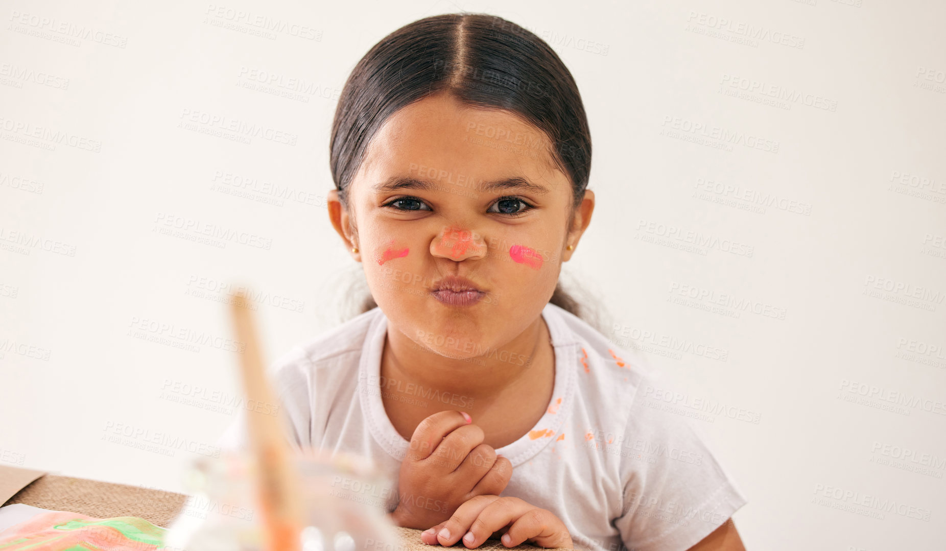 Buy stock photo Cropped shot of an adorable little girl with paint on her face