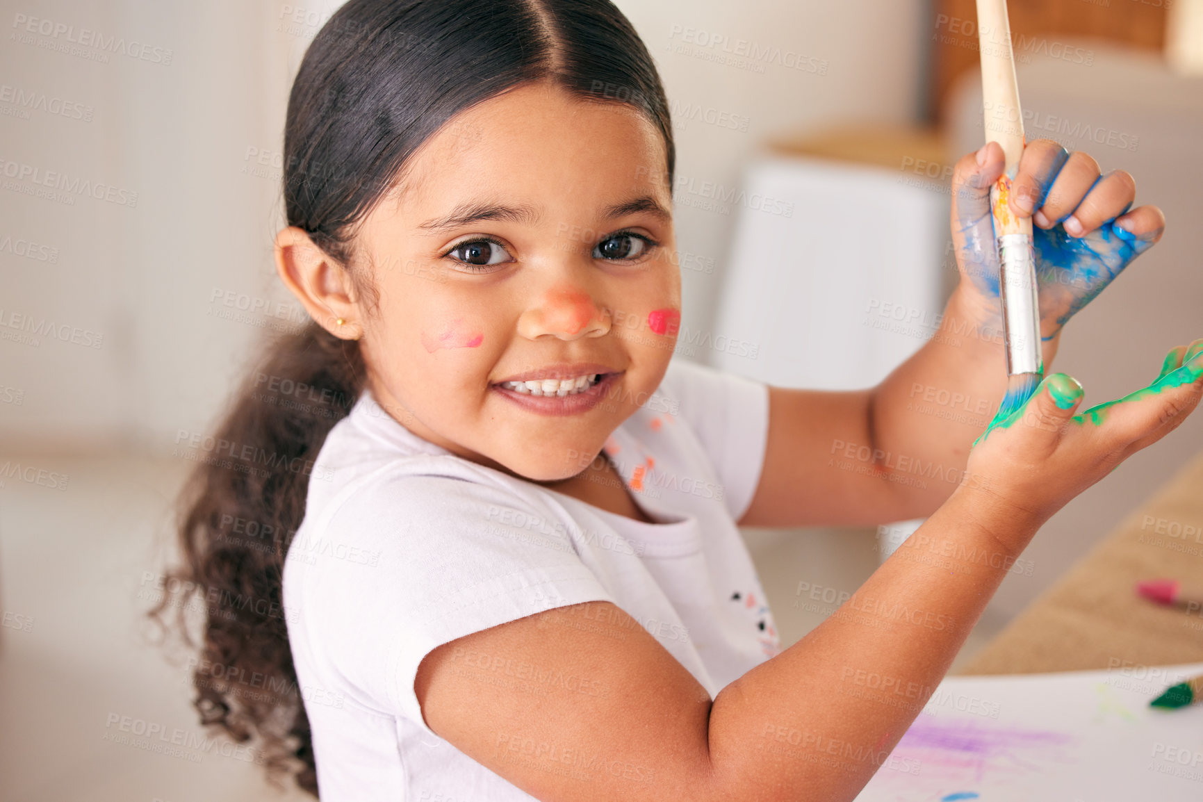 Buy stock photo Cropped shot of an adorable little girl painting her hands