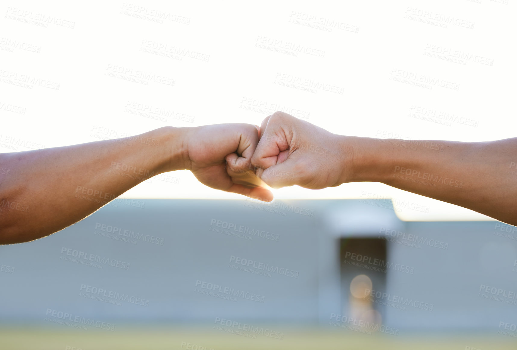 Buy stock photo Cropped shot of two unrecognizable men bumping fists