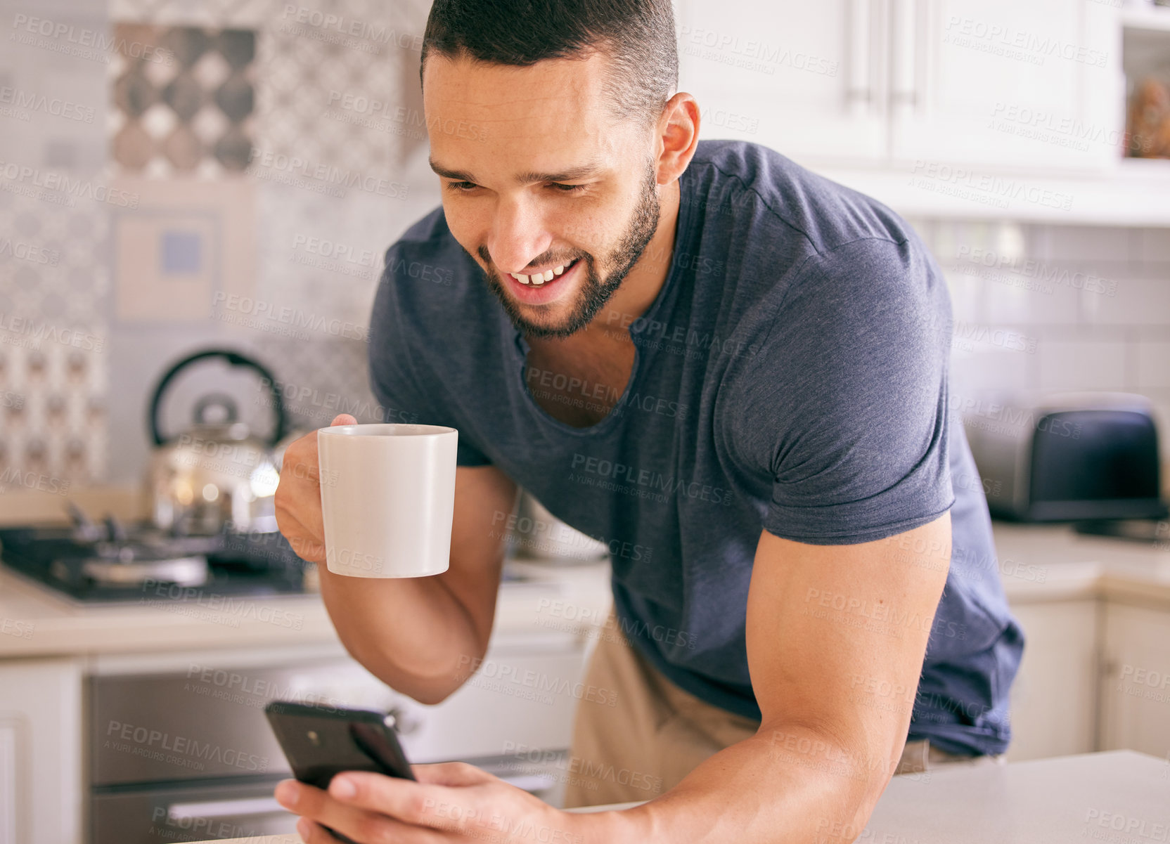 Buy stock photo Home, coffee and man with cellphone, typing and connection with internet and latte in kitchen. Person in house, social media and guy with morning tea and cappuccino with smartphone, texting and smile