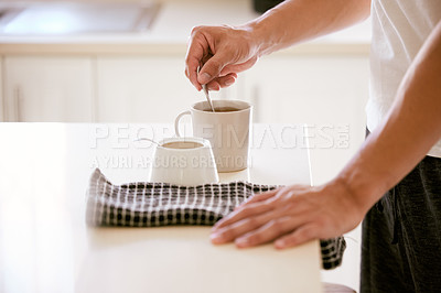 Buy stock photo Shot of an unrecognizable man stirring a cup of tea