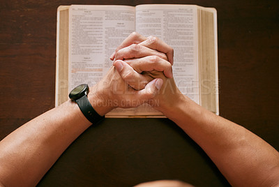 Buy stock photo Top view, praying and man with bible, hands and spiritual with religion and faith for guidance and scripture. Closeup, guy in house and peace with routine and holy book with gratitude and believe