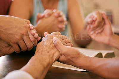Buy stock photo Bible, God or family holding hands in prayer for peace, trust or help, guide or spiritual healing at home. Worship, church or community praying in solidarity to Jesus Christ with support or gratitude