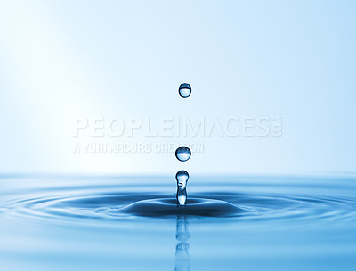 Buy stock photo Abstract studio shot of a water droplet falling into a puddle of water