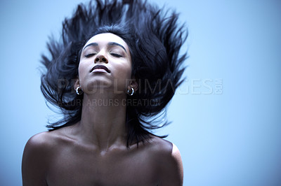 Buy stock photo Shot of a young woman with gorgeous hair in a studio