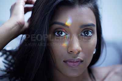 Buy stock photo Shot of a young woman looking at the camera in a studio