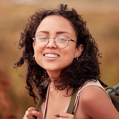 Buy stock photo Woman, hiking and portrait with smile for journey, peace and outdoors adventure for exercise. Female person, face and happiness for fitness, wellness and mindset with backpack on summer walk