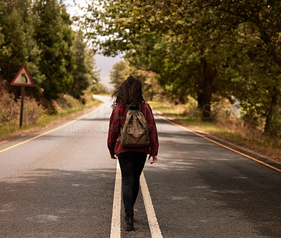 Buy stock photo Travel, woman and walking with backpack on road in the countryside for hiking or journey in Ukraine. Back, girl or trekking on highway outdoor for war, disaster or apocalypse with rear view in nature