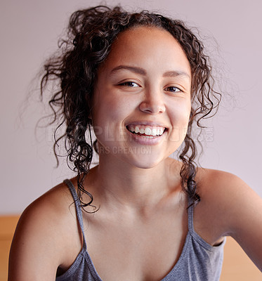 Buy stock photo Portrait of a beautiful young woman sitting at home