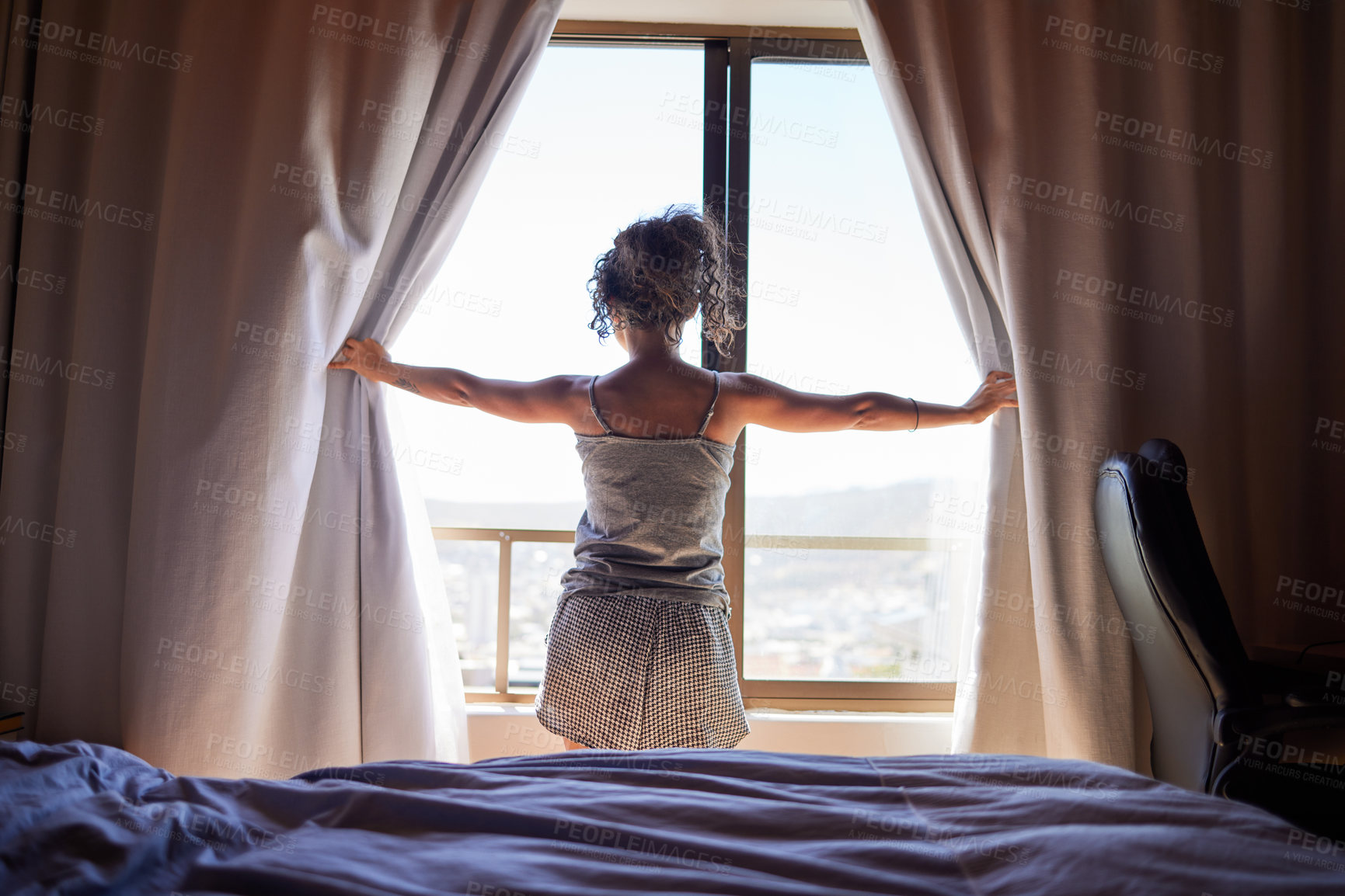 Buy stock photo Morning, bedroom and woman opening curtain for sunshine, fresh air getting ready for new day. Relax, wake up and female person at window with light, peace and thinking with view at home from back