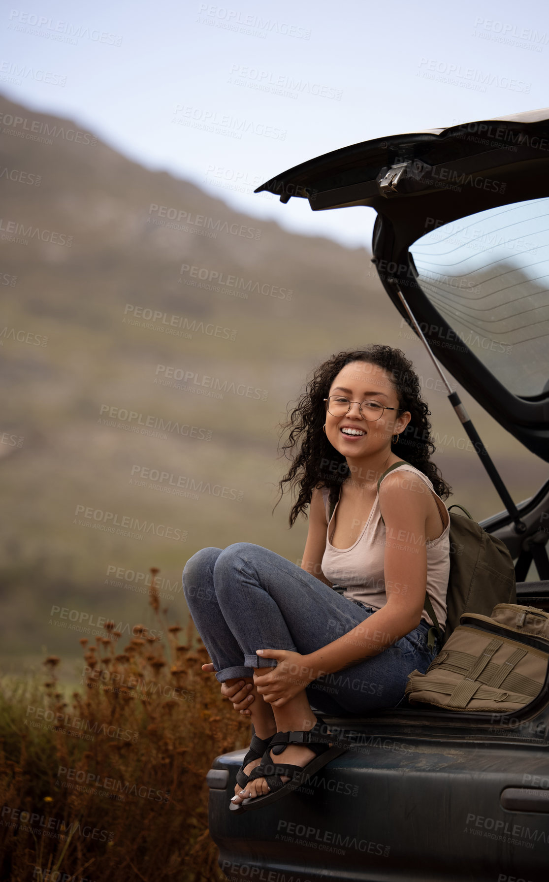 Buy stock photo Road trip, portrait and woman on back of car for adventure, summer vacation and holiday. Transport, relax and travel of calm female person in motor vehicle for freedom, journey and happy outdoors