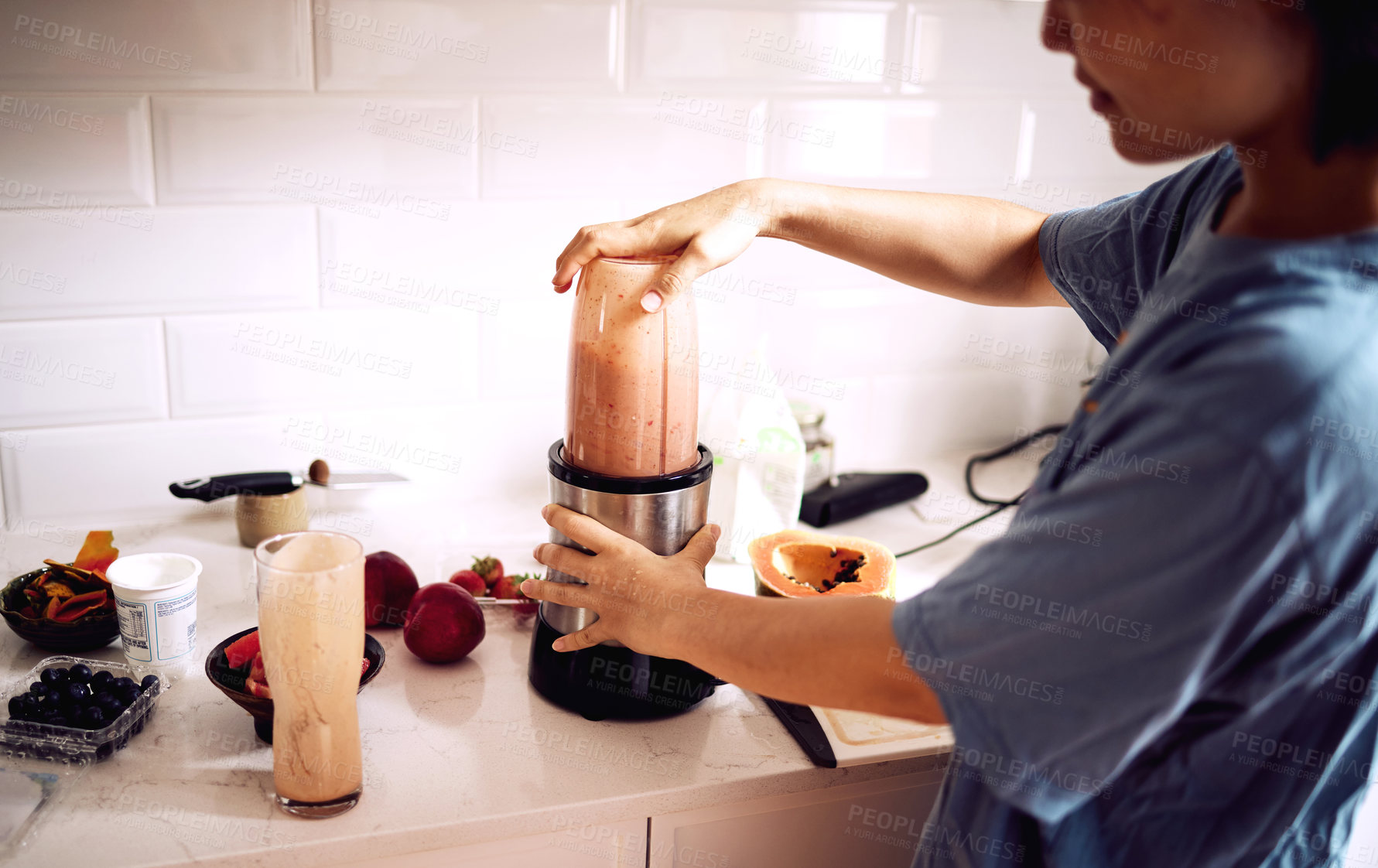 Buy stock photo Woman, fruit and smoothie in kitchen with blender for healthy breakfast, morning routine and body detox. Person, meal prep and food mixer for organic drink, wellness and vegan diet on counter in home