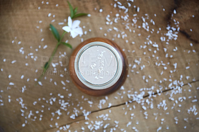 Buy stock photo Overhead shot of a coconut smoothie on a wooden table