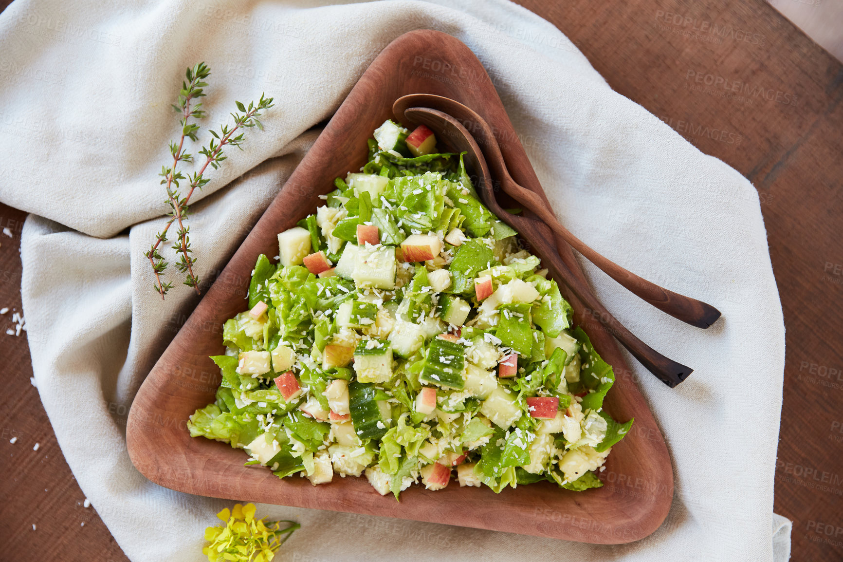 Buy stock photo Overhead shot of a chopped green salad in a wooden serving bowl