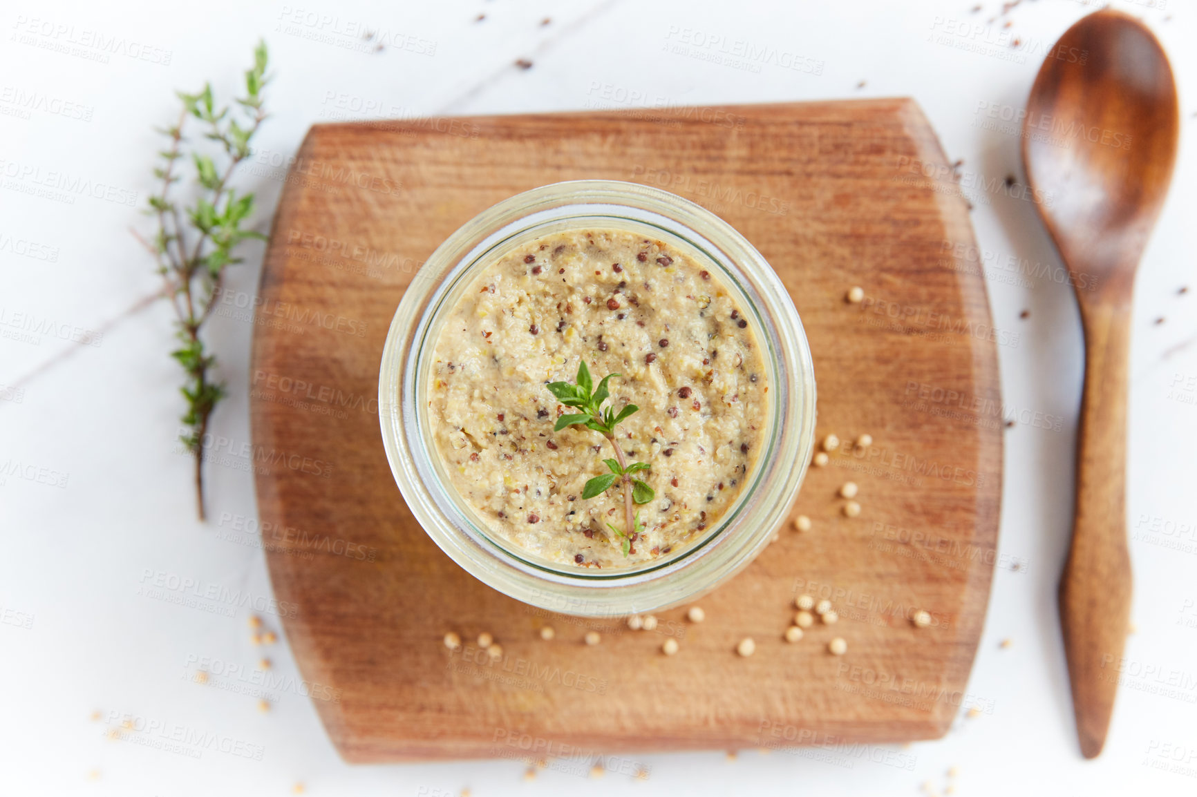 Buy stock photo Overhead shot of a healthy dip in a glass jar on a wooden table