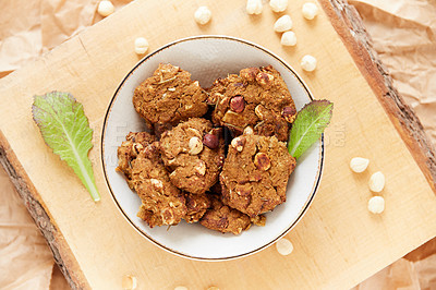 Buy stock photo Overhead shot of health bars in a wooden serving bowl on wooden board