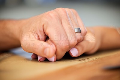 Buy stock photo Holding hands, support and trust with couple, marriage and empathy together on table. Ring, care and love with unity in a relationship with help, compassion and romance with woman and man with grief