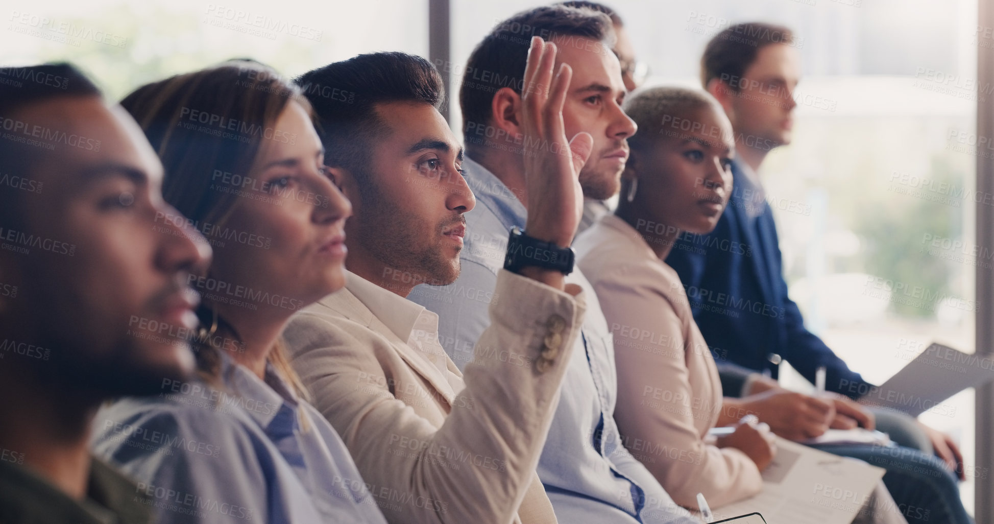 Buy stock photo Audience, conference and question of a business man with hand up at a seminar, workshop or training. Diversity men and women crowd at a presentation for learning, knowledge and faq discussion 