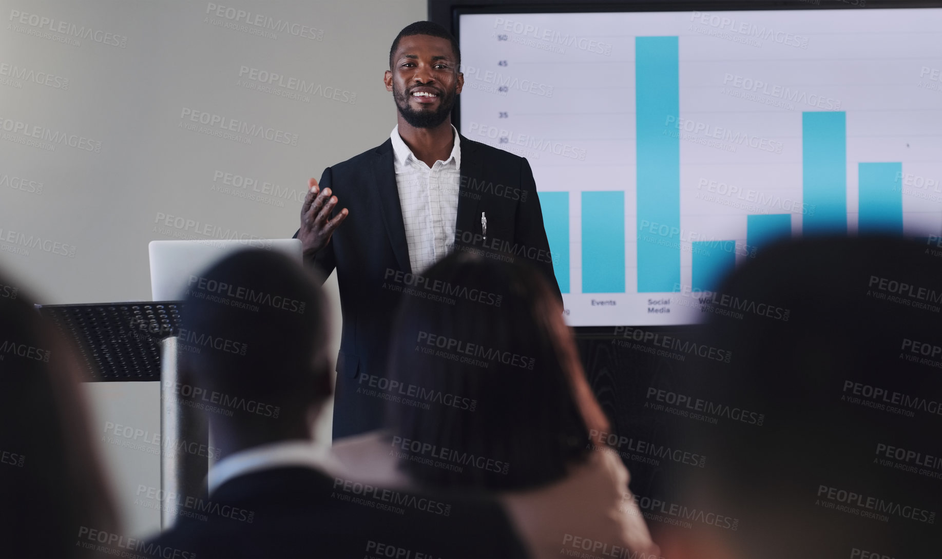 Buy stock photo Black man, presentation and speaker with business graphs at seminar, workshop or training. Men and women crowd at a conference for learning, knowledge and financial growth or development discussion