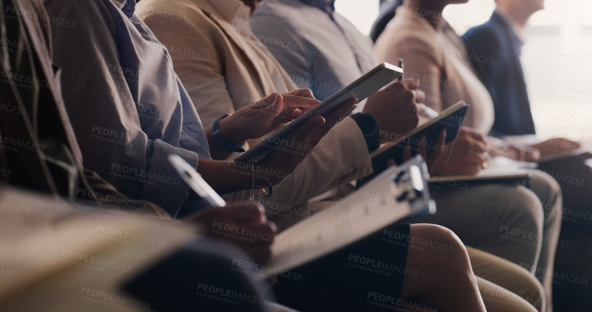 Buy stock photo Audience, conference and business people with a tablet and notes at a seminar, workshop or training. Hands of men and women crowd at a presentation for learning, knowledge and writing information