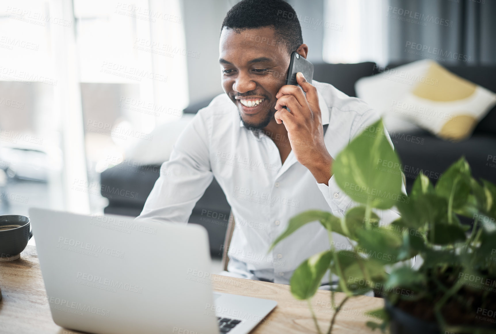 Buy stock photo Phone call, laptop and black man in home for remote work with communication to client for review. Contact, tech and African freelance financial advisor with positive feedback for investment growth.