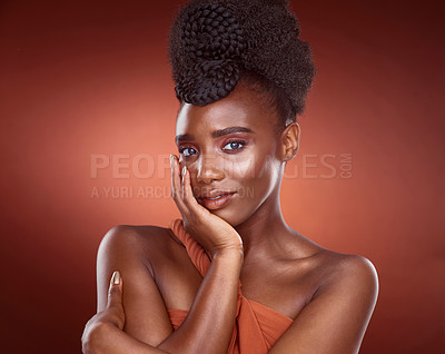 Buy stock photo Portrait, black woman and beauty cosmetics for skincare, wellness and dermatology isolated on red studio background. Face, touch and makeup of serious African model for shine, glow and aesthetic