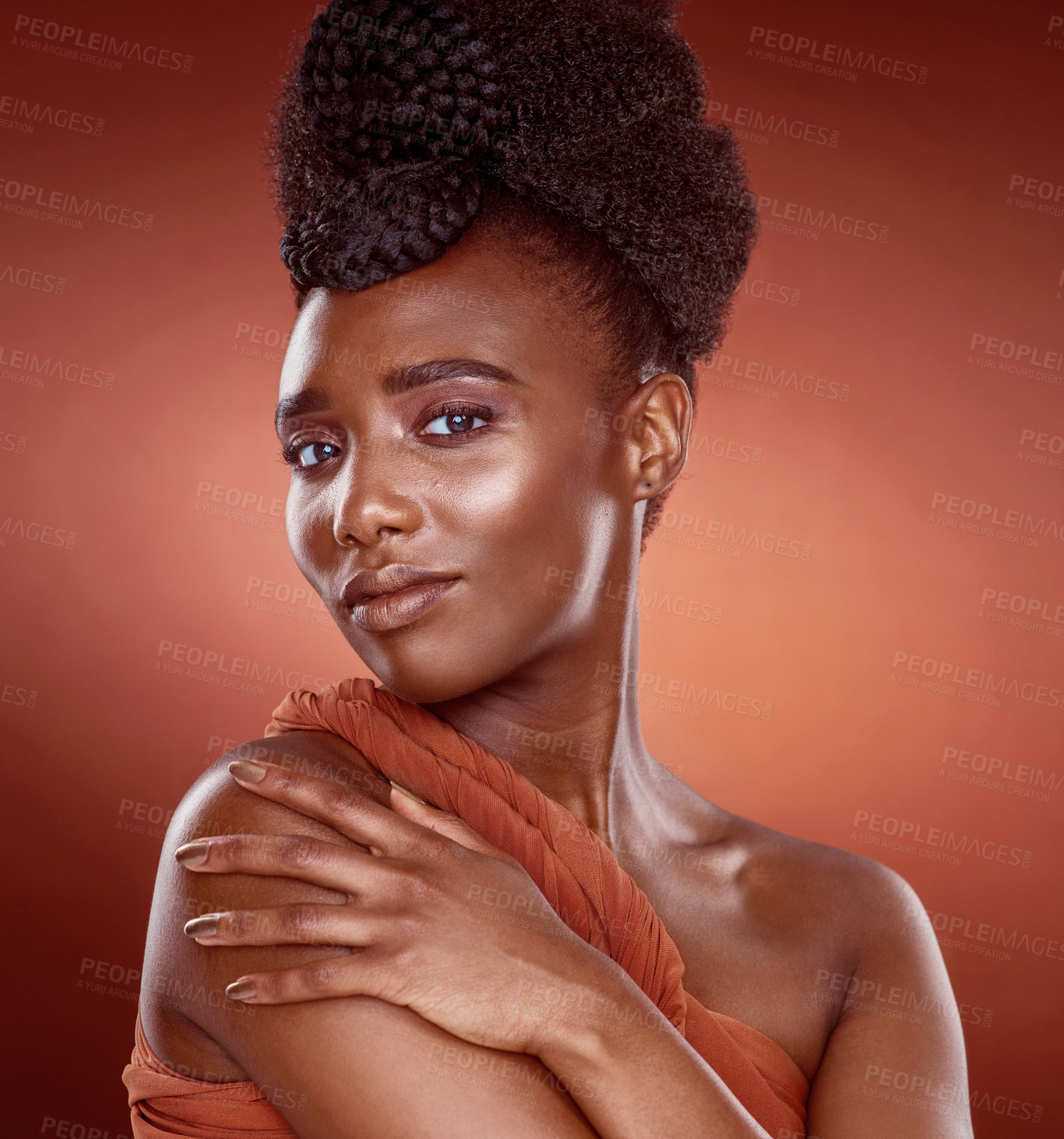 Buy stock photo Confident, black woman and makeup for portrait in studio for beauty or culture by red background. Pride, African and female person and cosmetic with foundation for glow or shine as model in Nigeria