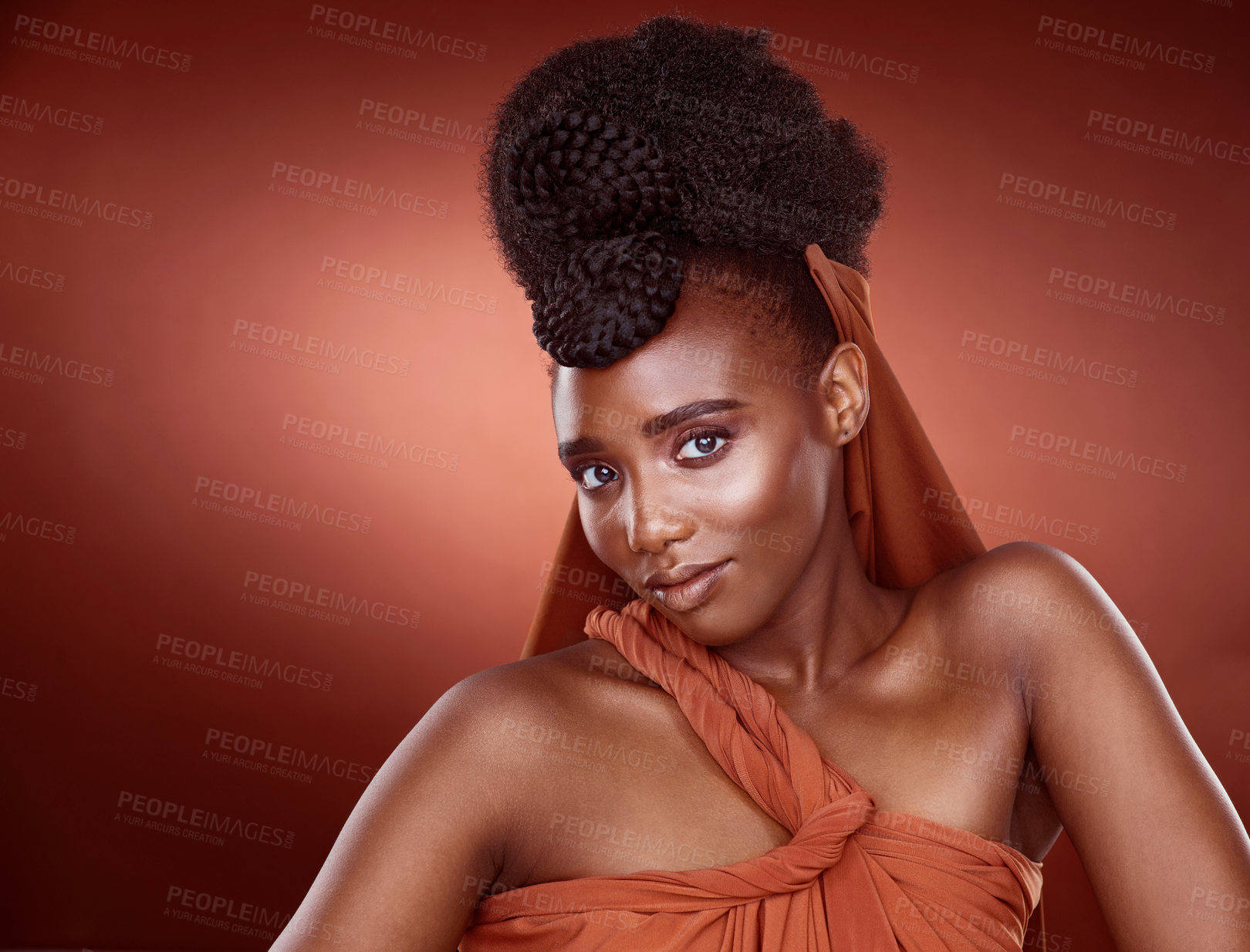 Buy stock photo Portrait, fashion and beauty of black woman with hairstyle in studio for glow or elegant braids isolated on red background. African culture, hair and model in makeup cosmetics for skin aesthetic