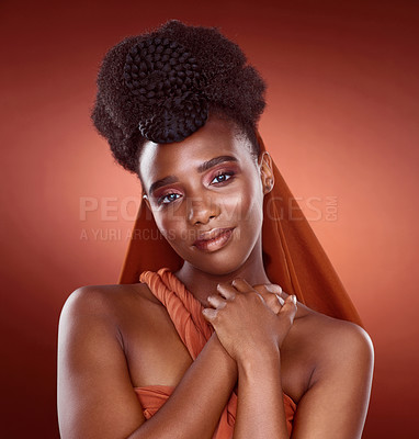 Buy stock photo Cropped portrait of an attractive young woman posing in studio against a red background