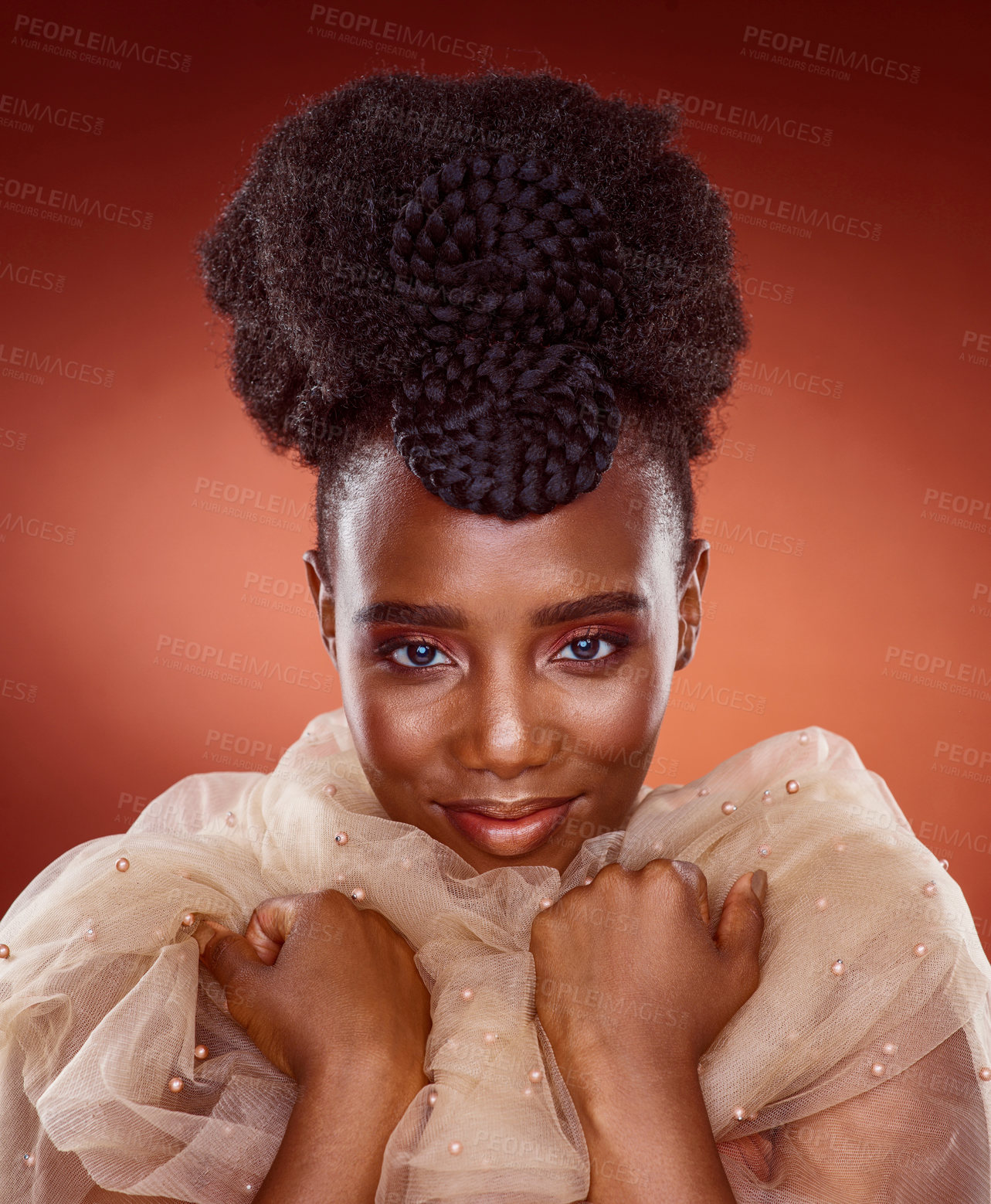 Buy stock photo Black woman, portrait and beauty with makeup in fashion for facial cosmetics on a red studio background. Young African, female person or attractive model with traditional clothing, care or pride