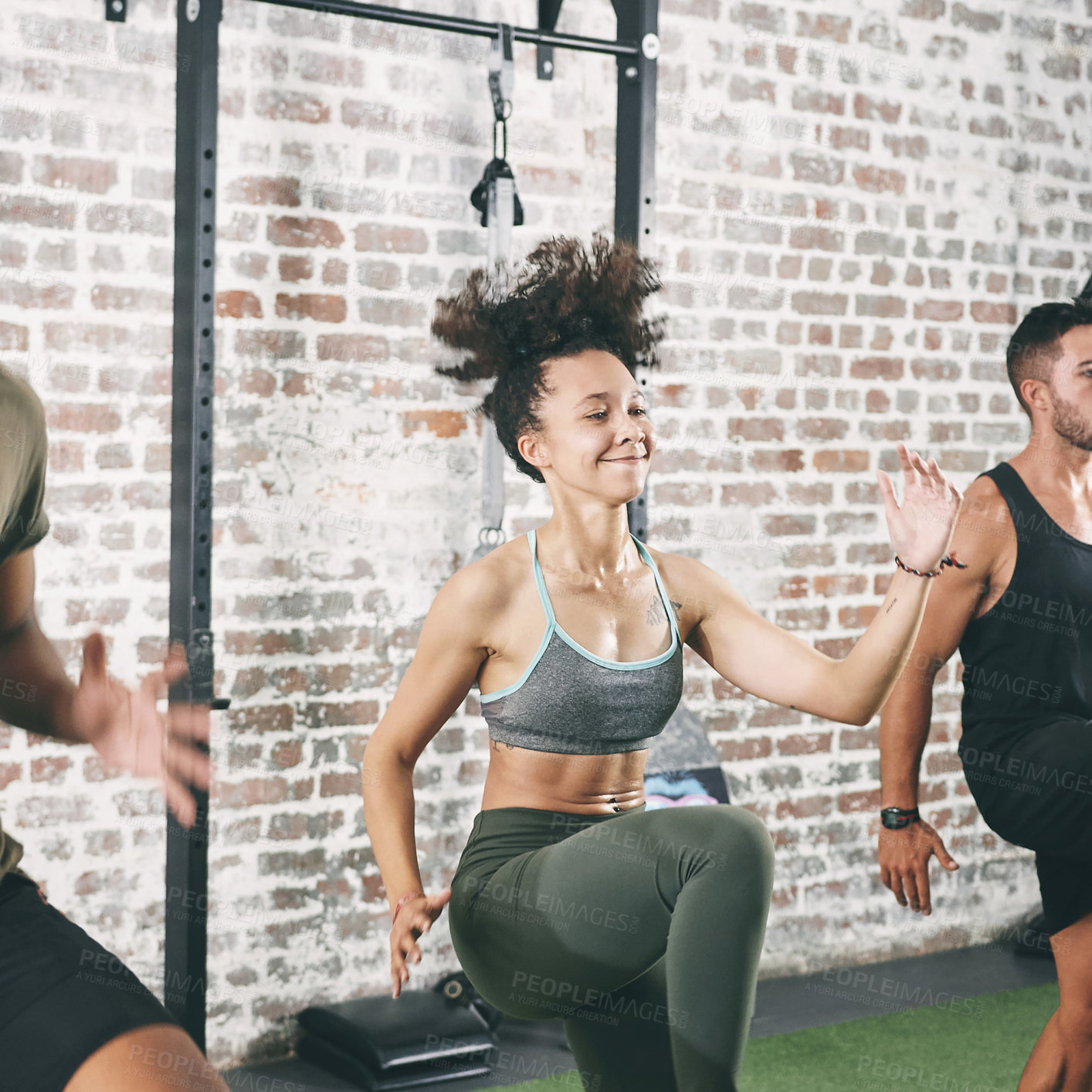 Buy stock photo Shot of a fitness group doing high knees while working out at the gym