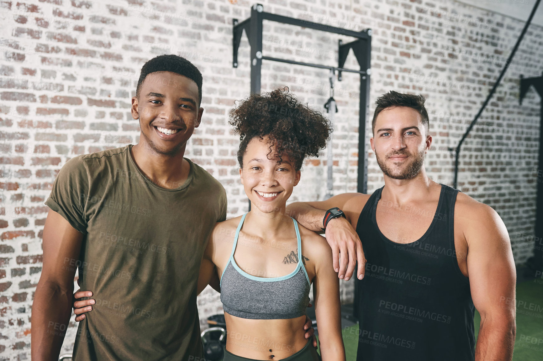 Buy stock photo Shot of a fitness group standing together in the gym