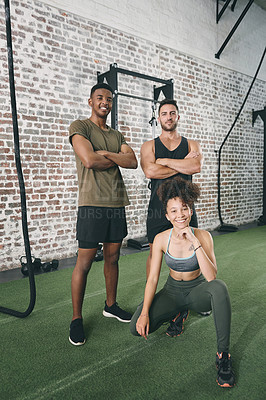 Buy stock photo Shot of a fitness group standing together in the gym