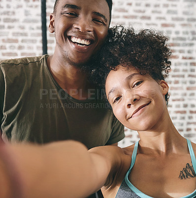 Buy stock photo Cropped shot of two sporty young people taking a selfie at the gym