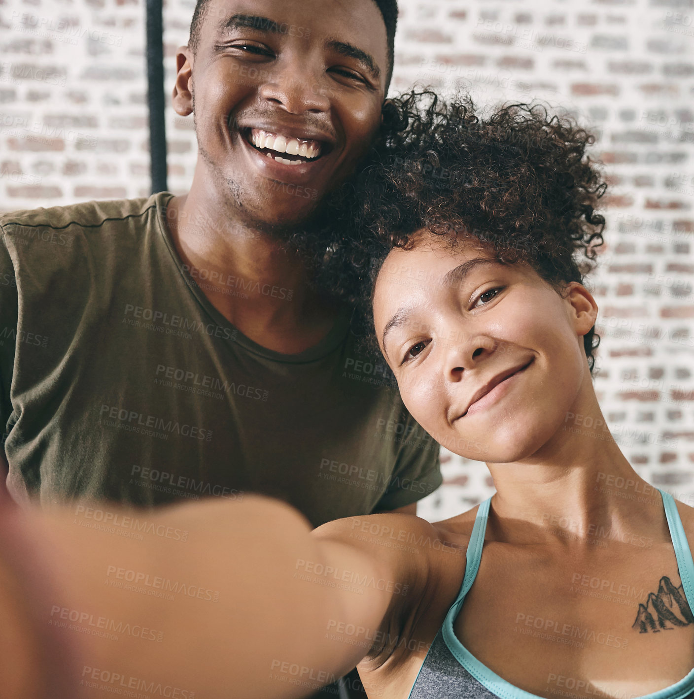 Buy stock photo Cropped shot of two sporty young people taking a selfie at the gym