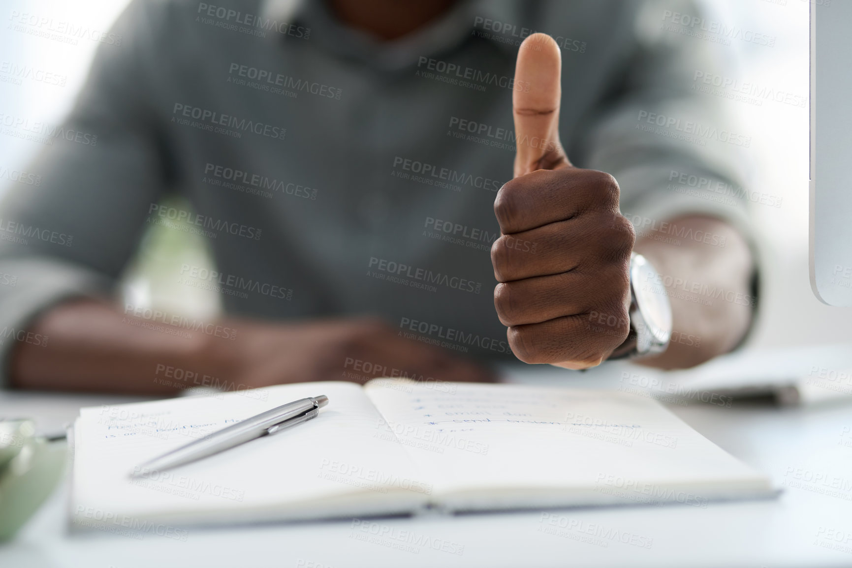 Buy stock photo Man, hands and notebook with thumbs up for winning, achievement or good job on office desk. Hand of male person with book in planning showing thumb emoji, yes sign or like for approval at workplace