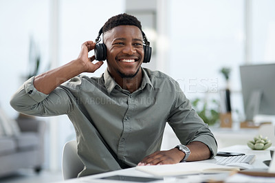 Buy stock photo Black man, headphones and listening to music in office with smile for sound track or podcast. Happy African male person or professional designer smiling with headset enjoying audio at the workplace