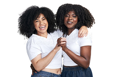 Buy stock photo Studio shot of two young women embracing each other against a white background