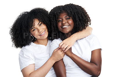 Buy stock photo Studio shot of two young women embracing each other against a white background