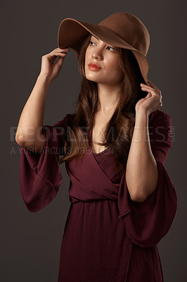 Buy stock photo Cropped shot of an attractive young woman posing in studio against a grey background