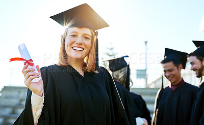 Buy stock photo Portrait of a student holding her diploma on graduation day