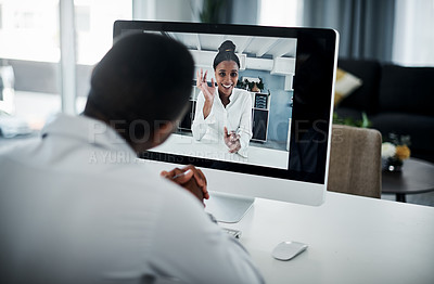 Buy stock photo Shot of an unrecognizable businessman sitting alone in his office and having a virtual meeting with a coworker