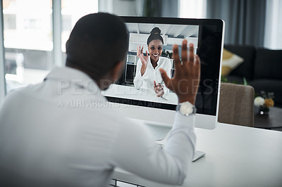 Buy stock photo Shot of an unrecognizable businessman sitting alone in his office and having a virtual meeting with a coworker