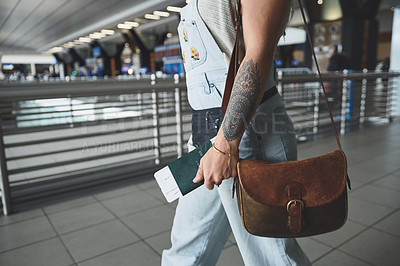 Buy stock photo Cropped shot of a woman on her way to board her flight at the airport