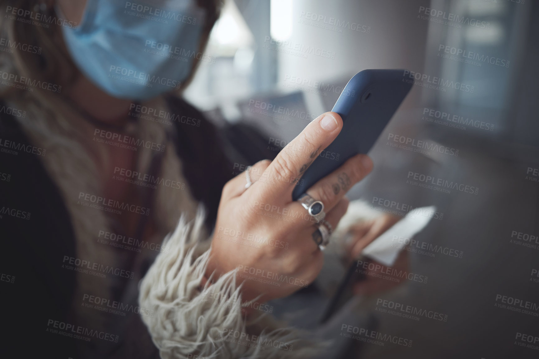 Buy stock photo Cropped shot of a woman using her phone in the airpot