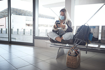 Buy stock photo Shot a young woman sitting with a bags in the airport